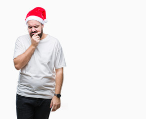 Young caucasian hipster man wearing christmas hat over isolated background thinking looking tired and bored with depression problems with crossed arms.