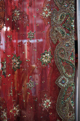 Beautiful Red mesh fabric for dress embroidered with gold and colorful sequins