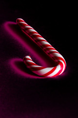 Christmas Stick of  hard candy on the black background
