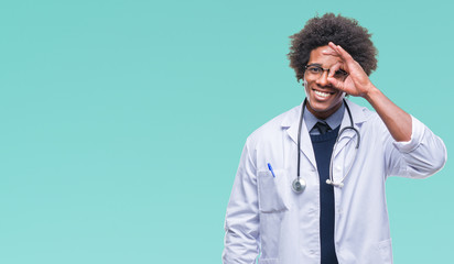 Afro american doctor man over isolated background doing ok gesture with hand smiling, eye looking through fingers with happy face.