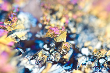 Beautiful colorful background of thin layer of titanium on the surface of quartz. Macro