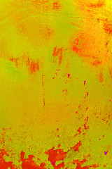 Grunge, Vintage. Closeup of an old red painted sheet iron, metal door with peeling paint and rust.