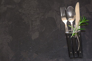 set of cutlery fork, spoon, knife (vintage). Black background. Top view . Copy space.
