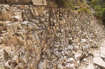 Pathway in the rocky side of a mountain (Marche, Italy, Europe)