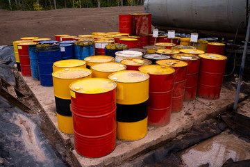 colored metal barrels. Blue oil drums containing fuel for transportation