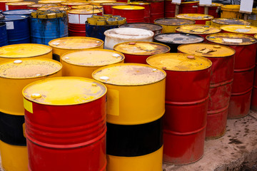 colored metal barrels. Blue oil drums containing fuel for transportation