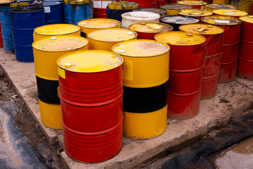colored metal barrels. Blue oil drums containing fuel for transportation