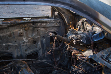 Fototapeta premium Closeup interior photo of a burnt out car