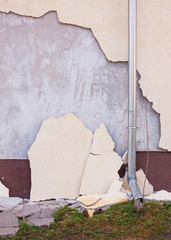 Damaged insulation of a house facade