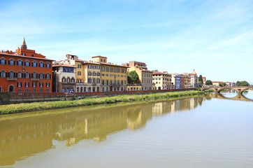 landscape of Florence or Firenze city Italy with impressive water reflections of the buildings on Arno river