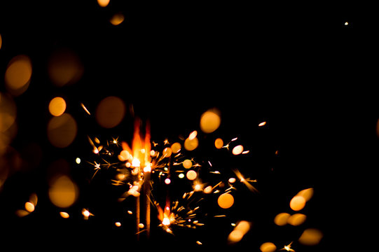 Blurred Sparks From Fire In Front Of Black Backgound