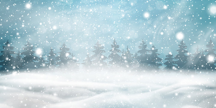 Natural Winter Christmas background with blue sky, heavy snowfall, snowflakes, snowy coniferous forest, snowdrifts. Winter landscape with falling christmas shining beautiful snow.