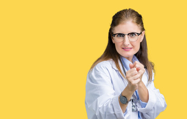 Middle age mature doctor woman wearing medical coat over isolated background Ready to fight with fist defense gesture, angry and upset face, afraid of problem