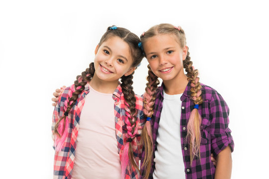 Trendy girls. Dress similar with best friend. Dress to match your friend. Best friend dressing. Friends wear similar outfits have same hairstyle braids white background. Sisters family look outfit