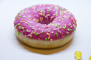 Pink donut on a white background
