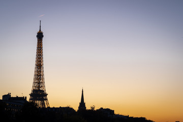 Paris, France - 11 18 2018: panoramic view of Paris and the Eiffel Tower from the Alexander III bridge at sunset