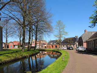 Fototapeta na wymiar Central street in town Spijk, Netherlands
