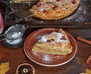  apple pie puff pastry on a brown ceramic plate