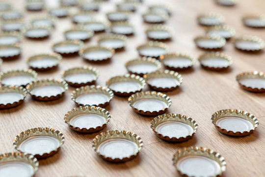 Beer cap on wooden table