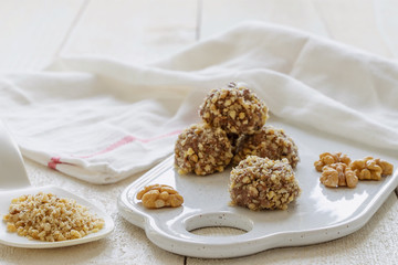 chocolate cake on a plate. cocoa. chocolate cake with coffee. chocolate and cookies. chocolate cake. white background and towel