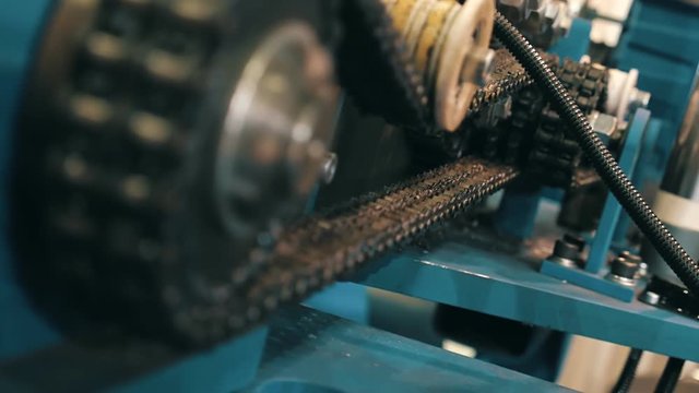 Industrial equipment with chain transmission, for accurate transmission of movement from the driving motor. Shot in motion
