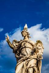Angel with the nails on the Ponte Sant'Angelo over the Tiber, at the Mausoleum of Roman Emperor Hadrian, usually known as Castel Sant'Angelo, in Rome, near the Vatican. Italy