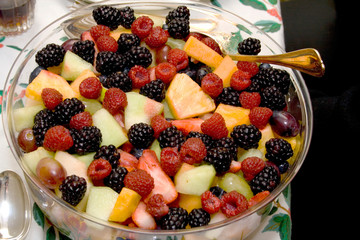 Nutritious fresh fruit bowel of raspberries grapes melon blackberries and pineapple. St. Paul Minnesota MN USA