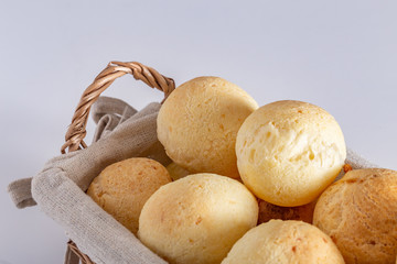 Brazilian homemade cheese bread, AKA 'pao de queijo' in a rustic basket.