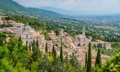 Fototapeta na wymiar Panoramic view in Assis with San Rufino Cathedral and Santa Chiara Basilica. Umbria, Italy.