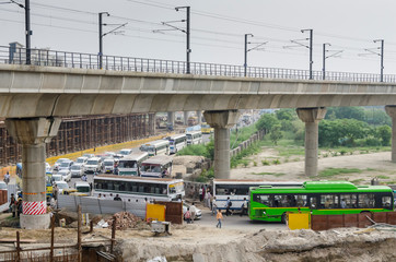major traffic jam with buses and cars commuting in new delhi