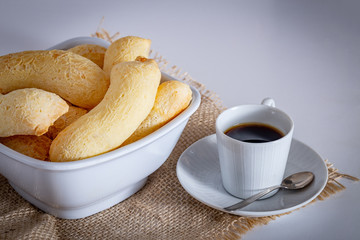 Brazilian homemade cheese bread, AKA ‘chipa’ isolated in white background and a cup of coffee.