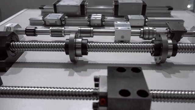 Trapezoidal screw for precise and powerful linear movement of parts in industrial equipment. Shot in motion
