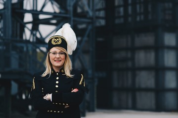 Woman black coal miner foreman in gala parade uniform