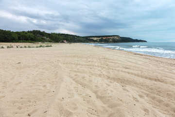 Deserted wild beach without people. Beautiful wild beach with clear turquoise water.