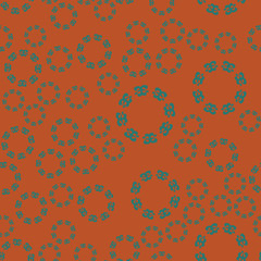 Ethnic floral seamless pattern on brown