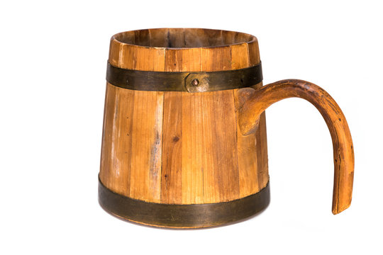 Old traditional wooden mug isolated on white background