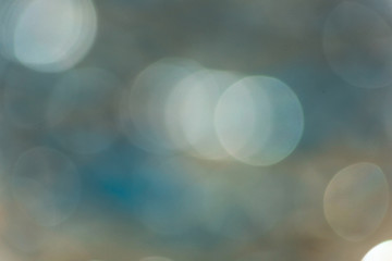 Dim gray with blue background with bokeh