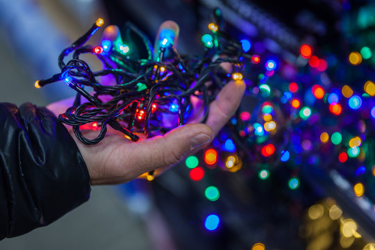 the man chooses in the LED light shop for vanity decoration