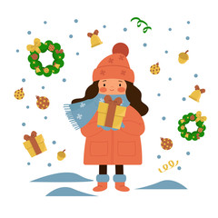 Young girl standing under the snow and holding a gift. Christmas wreath, gifts, Christmas decorations, acorn, bell. 