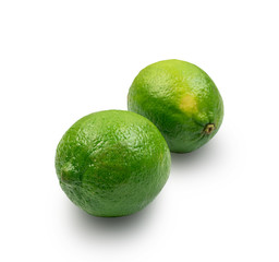 Sour key one whole lime isolated on white background