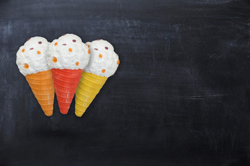 Three appetizing ice cream cones isolated on dark background