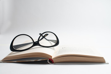 Notebook with glasses and pen, Book with glasses, Blue notebook with glasses, Book with cup of tea