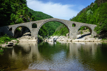 Fototapeta premium Devil's Bridge in Ardino Bulgaria top on Arda River, It is Ottoman Architecture Bridge in Rodopi Mountains 