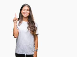 Young beautiful arab woman over isolated background showing and pointing up with finger number one while smiling confident and happy.