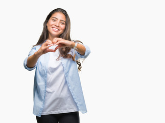 Young beautiful arab woman over isolated background smiling in love showing heart symbol and shape with hands. Romantic concept.