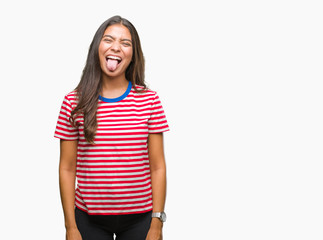 Obraz premium Young beautiful arab woman over isolated background sticking tongue out happy with funny expression. Emotion concept.