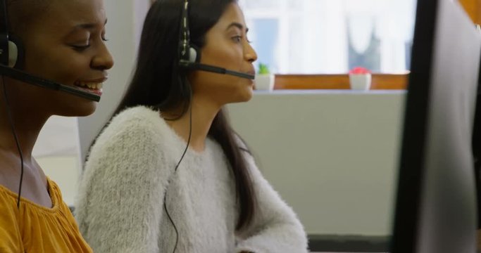 Business executives working with headset on desk 4k