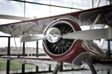 Sunlit isolated partial view of vintage biplane fixed wing aircraft 