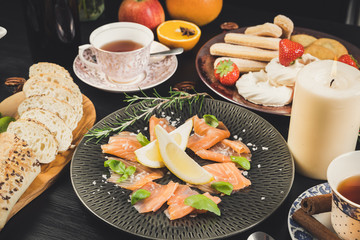 sharing christmas food table diet organic hands celebration homemade drinks tea candle dinning eating friends