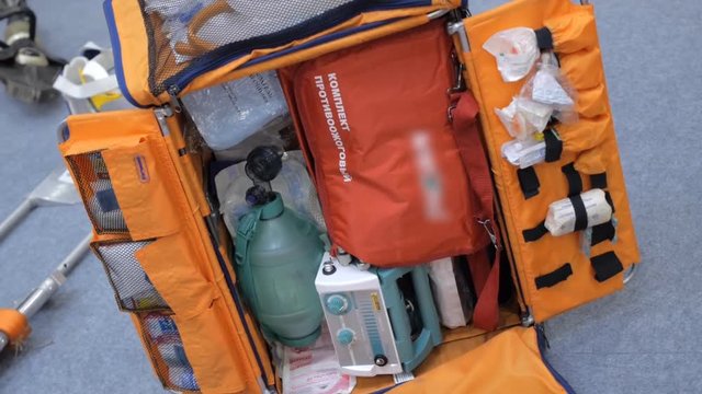 Large bag with an extended first aid kit designed for rescue service. Shot in motion
